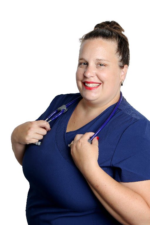 Smiling nurse in blue scrubs with stethoscope