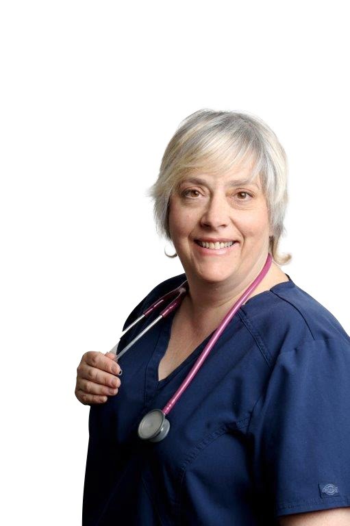 Smiling nurse in navy scrubs with stethoscope